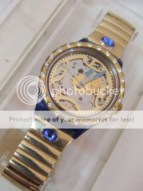 SAN101 Swatch   1993 Mappamondo Special Crystal Gold  