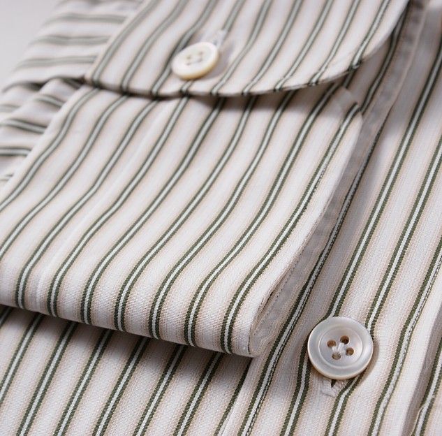 White cotton base with tasteful green stripe pattern.