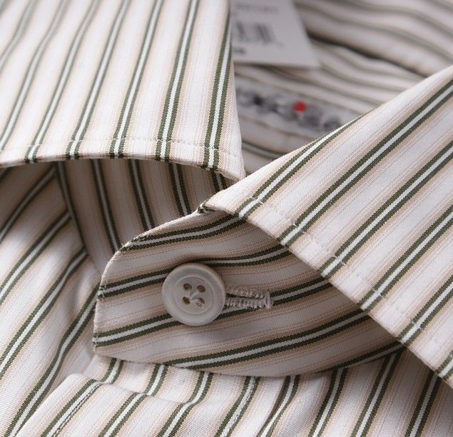 White cotton base with tasteful green stripe pattern.